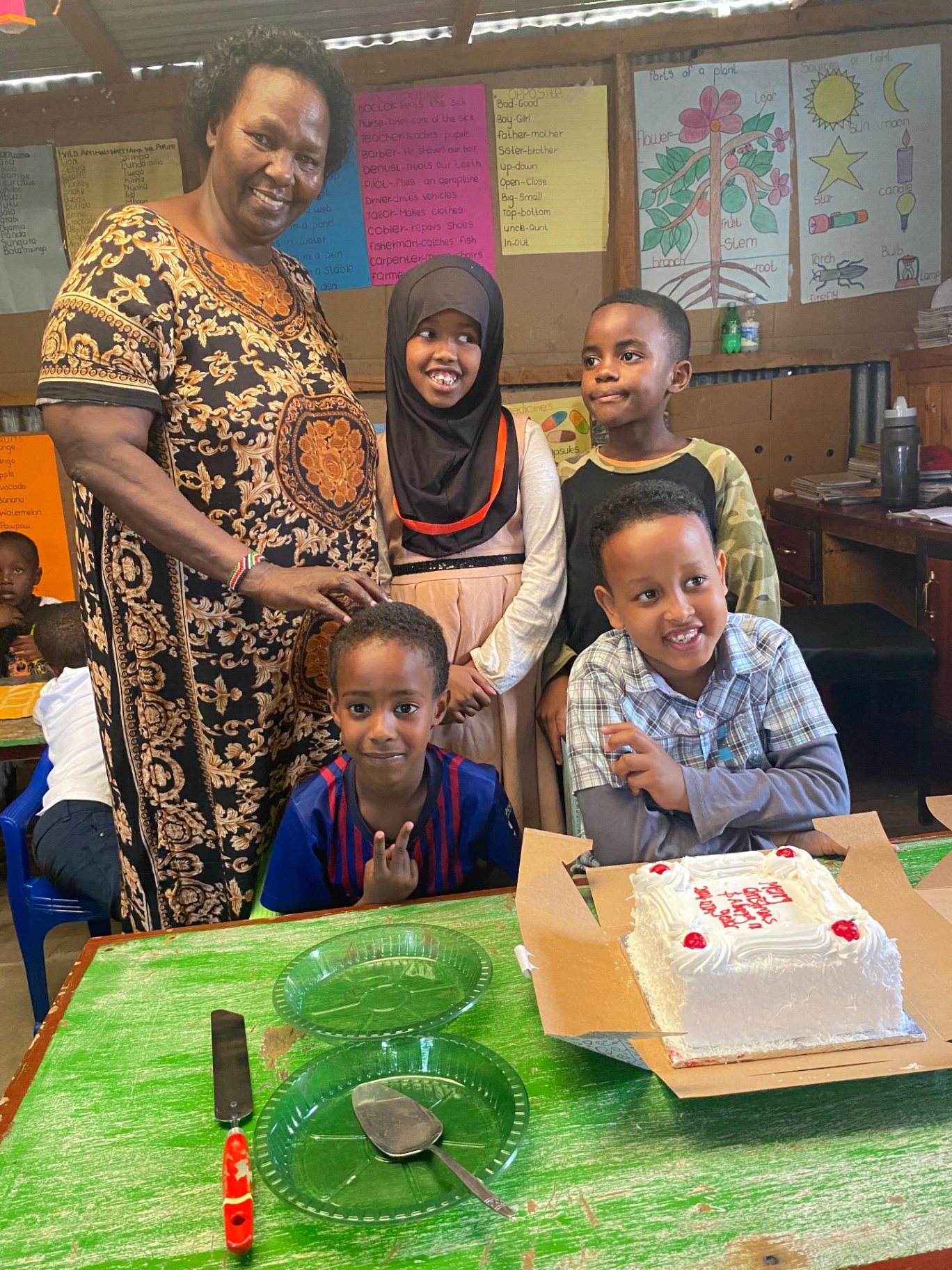 Mama Joy celebrating a birthday with her students